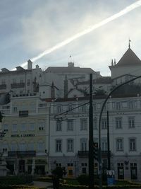 View of buildings in town against sky