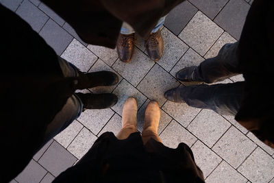 Low section of people standing on street