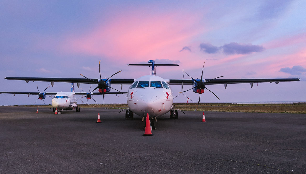 air vehicle, airplane, sky, airport, transportation, airport runway, mode of transportation, cloud - sky, nature, public transportation, runway, no people, travel, sunset, outdoors, aerospace industry, dusk, propeller, flying, stationary, plane