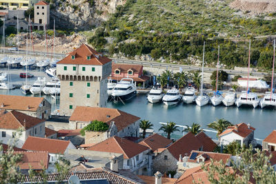 Boats in river with buildings in background