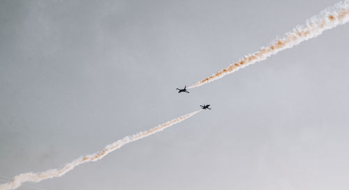 Low angle view of airplane flying in sky