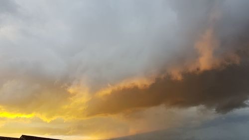 Scenic view of dramatic sky during sunset
