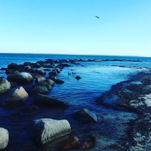 Scenic view of sea against cloudy sky