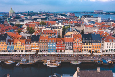 Famous nyhavn pier with colorful buildings and boats in copenhagen, denmark.