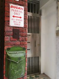 Close-up of text on brick wall