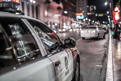 Cars on street in city at night