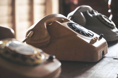 Close-up of vintage telephones on table