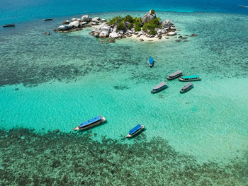 High angle view of people swimming in sea