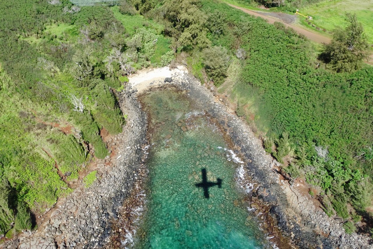 HIGH ANGLE VIEW OF WATER FLOWING ON LAND