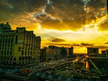 High angle view of buildings against sky during sunset