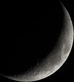 Low angle view of moon against sky at night