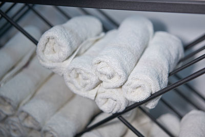 High angle view of white tied up on metal railing