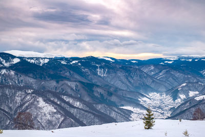 Scenic view of snowcapped mountains against sky