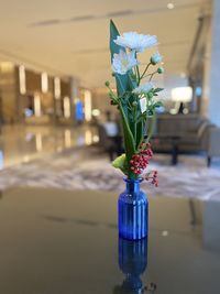 Close-up of flower vase on table