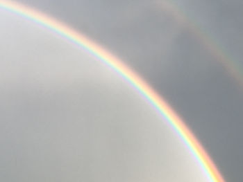 Low angle view of rainbow against sky