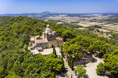 Aerial shot of santuari de bonany monastery on sunny day, petra, balearic islands, spain