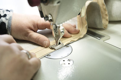 Cropped hand of man working in workshop