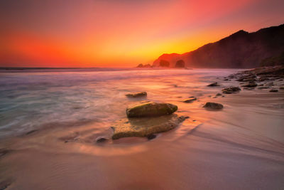 Scenic view of sea against sky during sunset