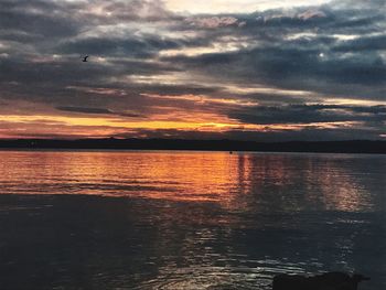 Scenic view of sea against sky at sunset