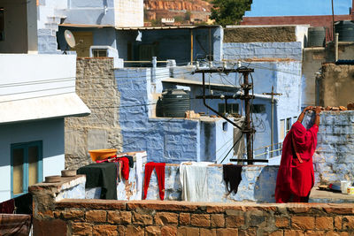 Rear view of woman standing on terrace