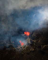 Smoke emitting from volcanic mountain