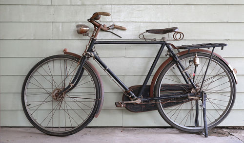 Bicycle parked on wall