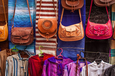 Purses hanging in store for sale at market