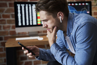 Young man using mobile phone