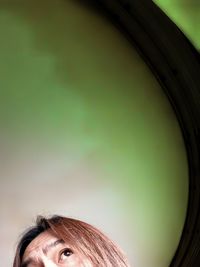 Close-up of woman against blurred background