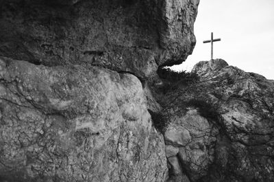 Rocks on cliff against sky