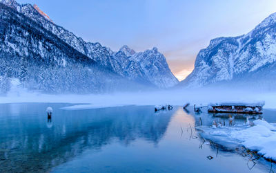 Scenic view of snowcapped mountains against sky during winter