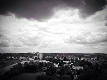 Cityscape against cloudy sky