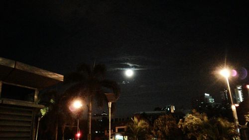 Low angle view of illuminated street light at night