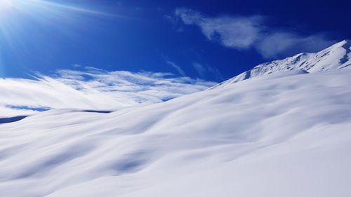 Low angle view of snowcapped mountain against sky