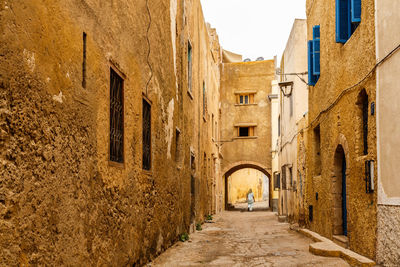 Alley amidst old buildings in town