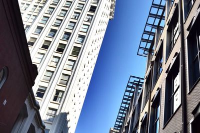 Low angle view of modern buildings against clear sky