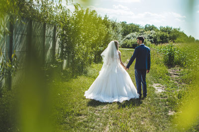 Rear view of couple in park