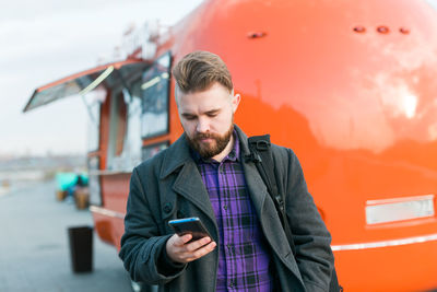Young man using mobile phone