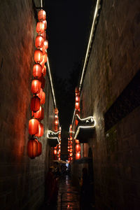 Low angle view of illuminated lights hanging from ceiling