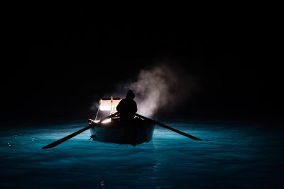 Rear view of man swimming in sea