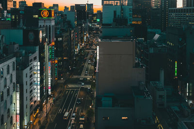 Aerial view of city lit up at night