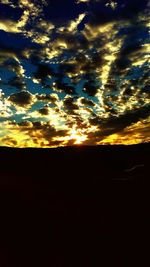 Scenic view of dramatic sky during sunset