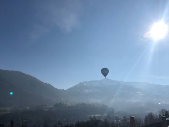 Silhouette of hot air balloon against sky