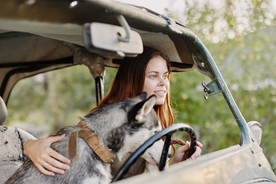 Portrait of young woman with dog