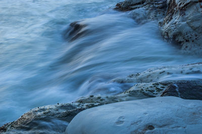 Scenic view of rocks in sea