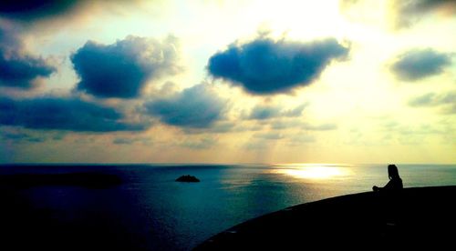 Scenic view of sea against cloudy sky