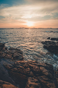 Scenic view of sea against sky during sunset