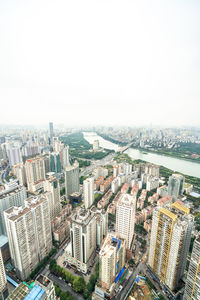 High angle view of buildings in city against clear sky