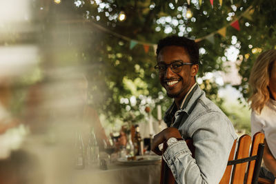 Man sitting at table in garden