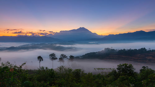 Scenic view of mountains against sky during sunset